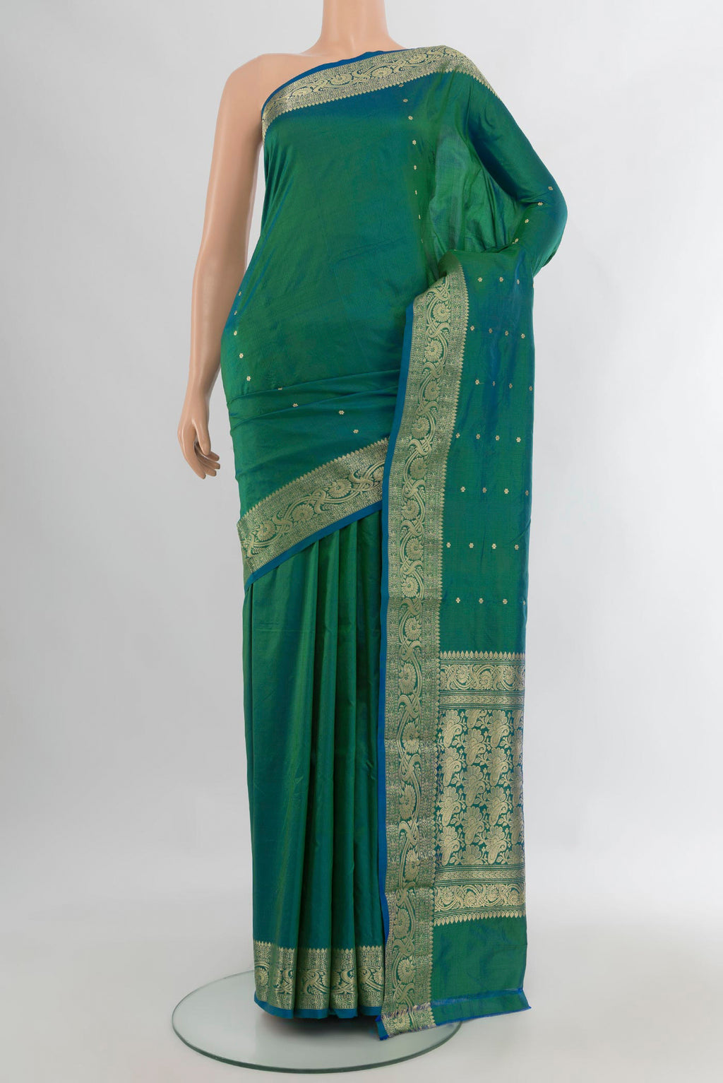 Pure Silk Peacock Blue Dual Tone Banarasi Katan Saree with Zari Butta on the body and Zari Border.  displayed on a mannequin