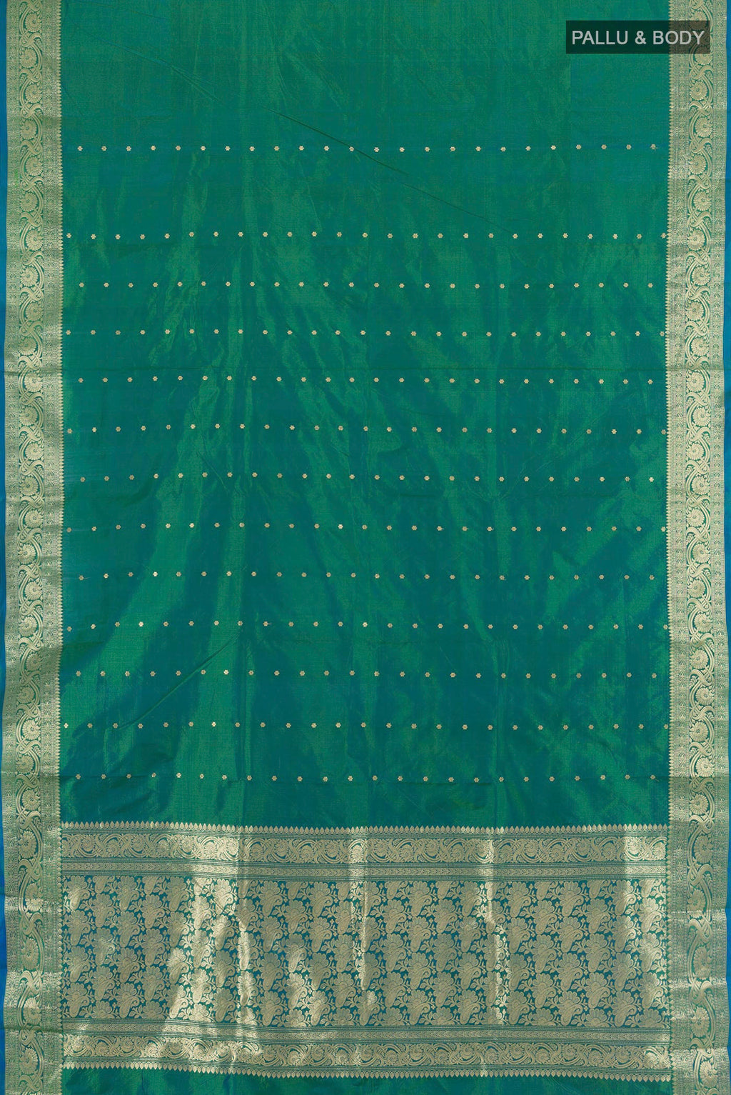 Flat view of Pure Silk Peacock Blue Dual Tone Banarasi Katan Saree with Zari Butta on the body and Zari Border. 