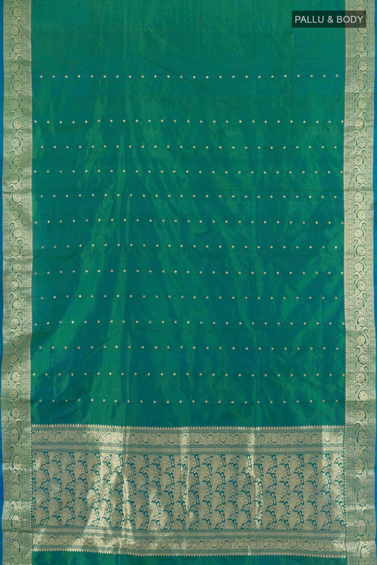 Flat view of Pure Silk Peacock Blue Dual Tone Banarasi Katan Saree with Zari Butta on the body and Zari Border. 