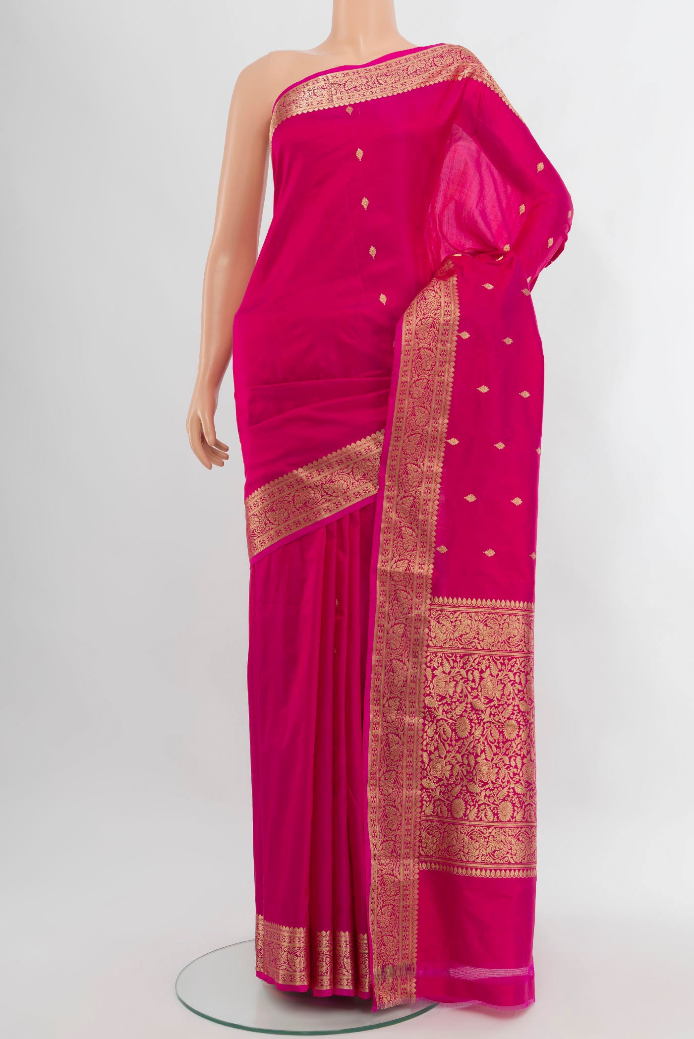 Dark Pink Banarasi Katan Silk Saree with Zari Butta on the body and Zari Border.  displayed on a mannequin
