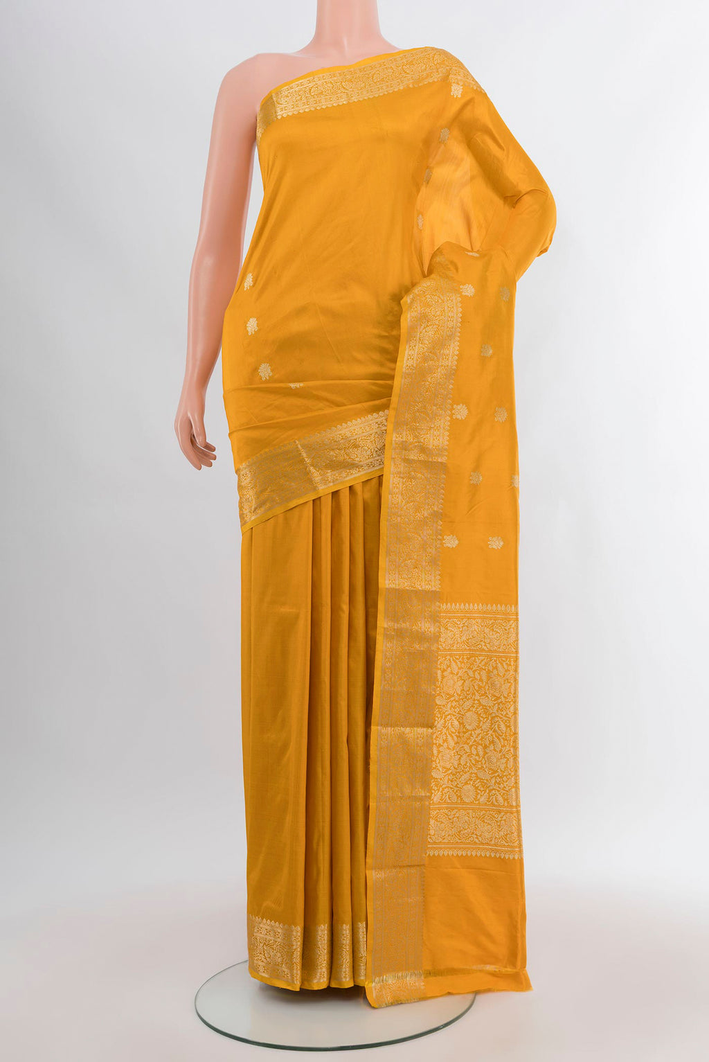 Yellow Banarasi Katan Silk Saree with Zari Butta on the body and Zari Border.  displayed on a mannequin