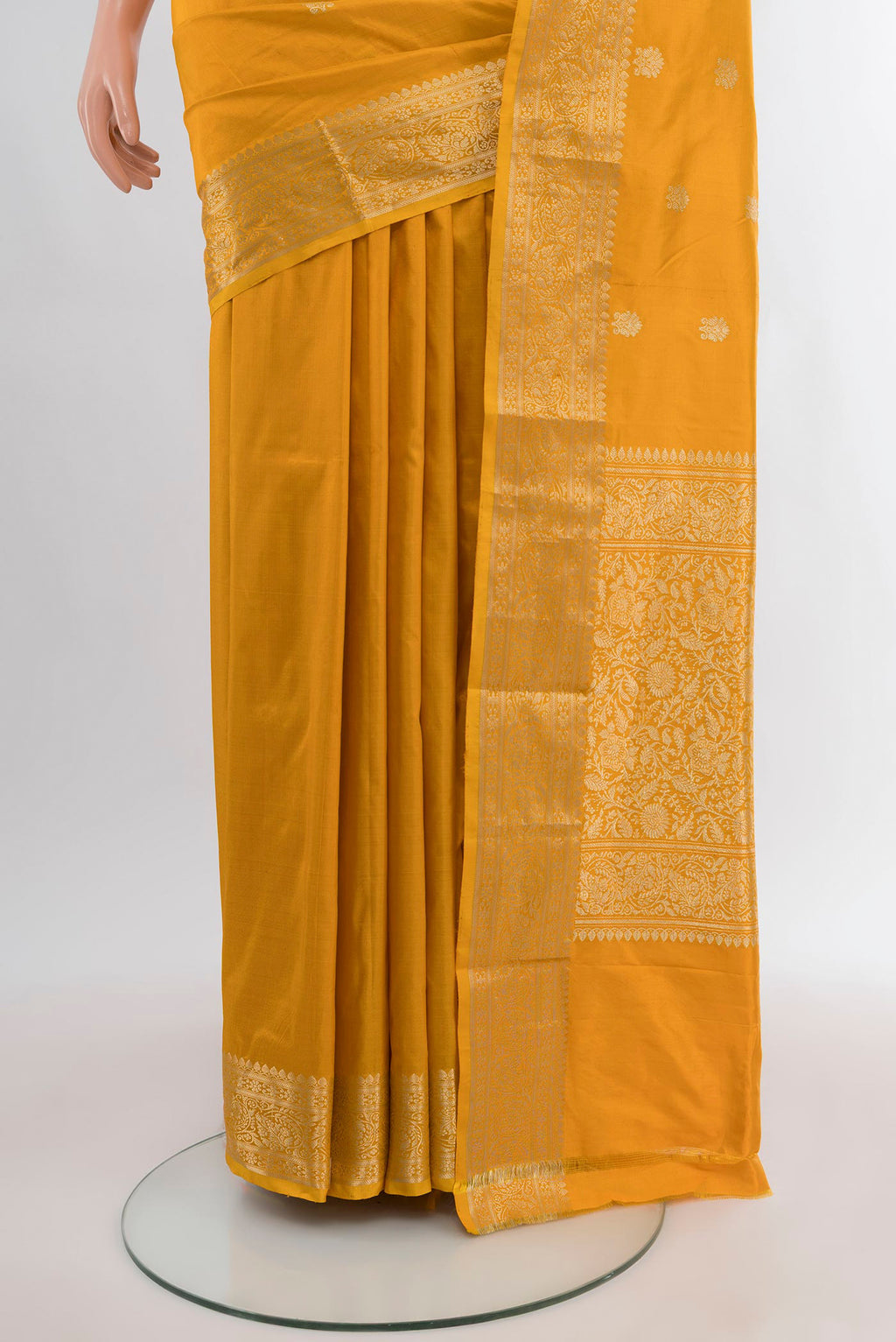 Pleats and pallu of Yellow Banarasi Katan Silk Saree with Zari Butta on the body and Zari Border. 