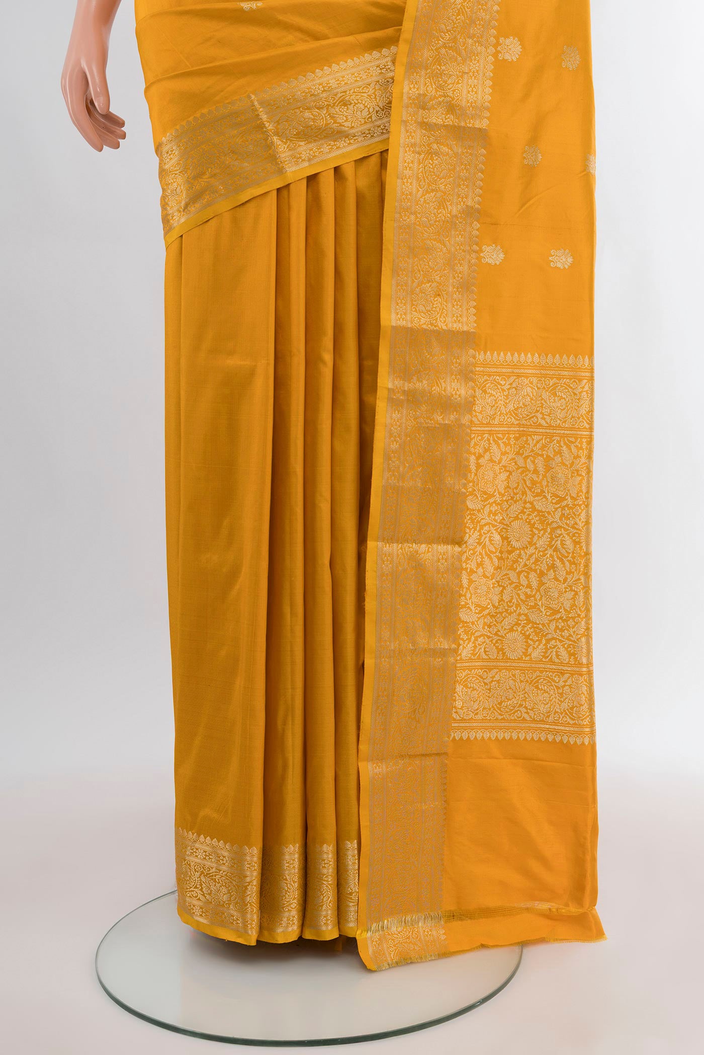 Pleats and pallu of Yellow Banarasi Katan Silk Saree with Zari Butta on the body and Zari Border. 
