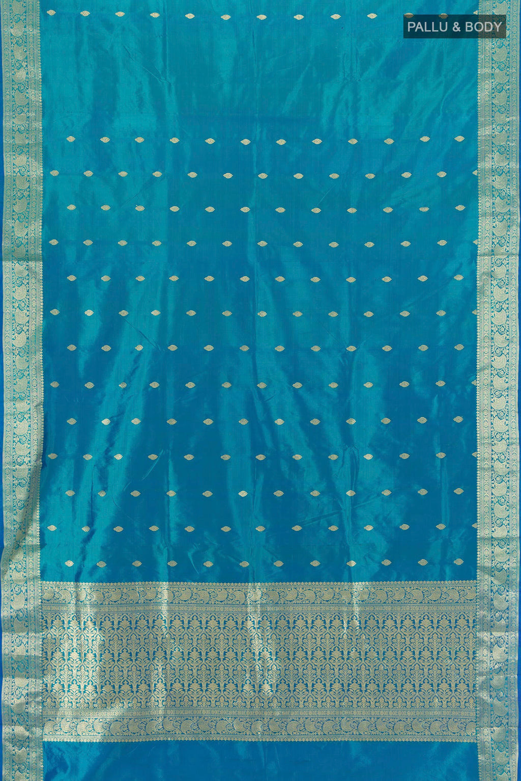 Flat view of Blue Banarasi Katan Silk Saree with Zari Butta on the body and Zari Border. 