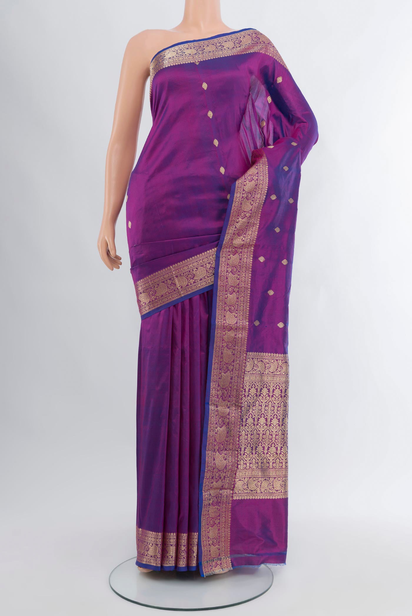 Purple Banarasi Katan Silk Saree with Zari Butta on the body and Zari Border.  displayed on a mannequin