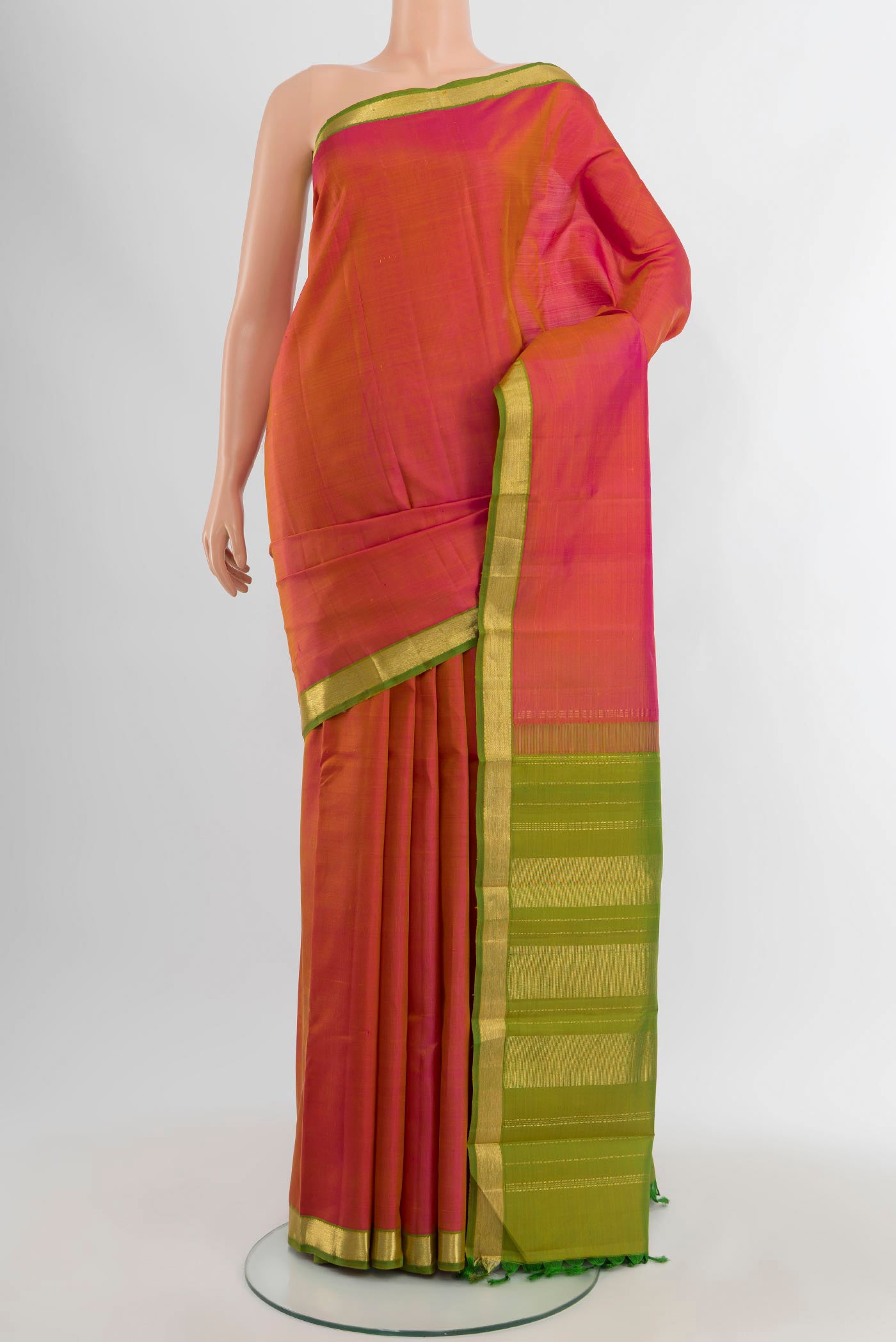 Pink Kanjivaram Silk Saree with Plain Body and Zari Border.  displayed on a mannequin