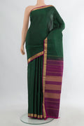 Pure Silk Bottle Green Kanjivaram Saree with Plain Body and Zari Border.  displayed on a mannequin