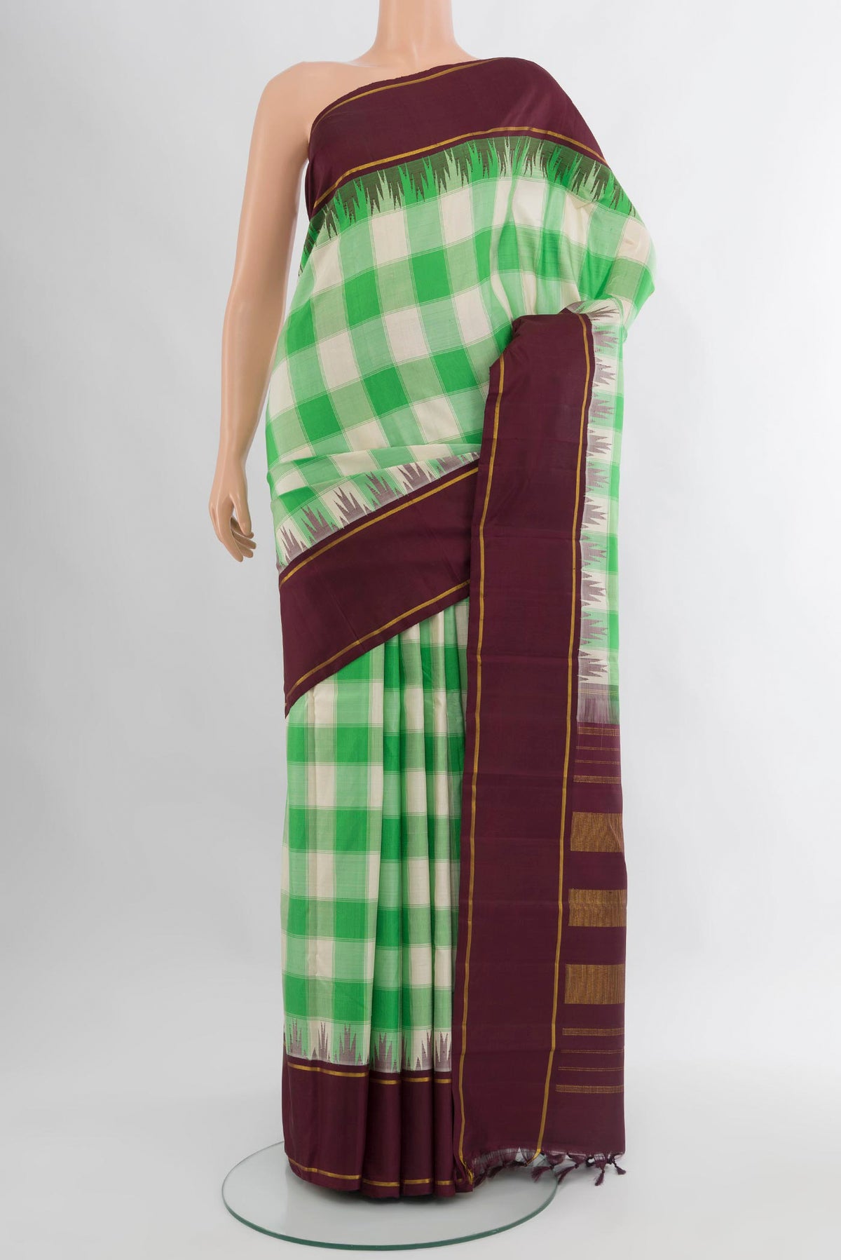 Multi Color Kanjivaram Silk Saree with Checked design on the body and Plain Border.  displayed on a mannequin