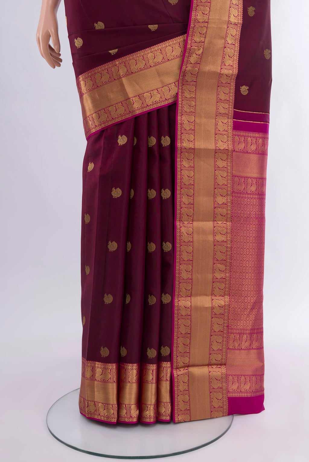 Pleats and pallu of Coffee Brown Kanjivaram Silk Saree with Zari Butta on the body and Zari Border. 