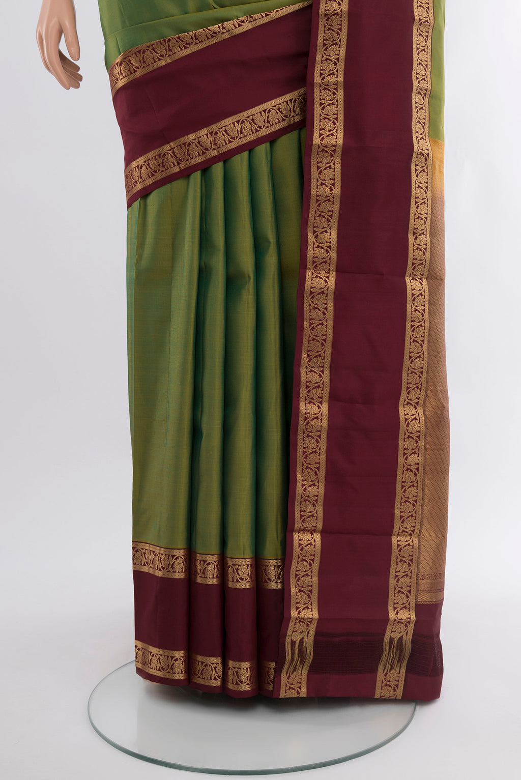 Pleats and pallu of Light Green Kanchipuram Silk Saree with Plain Body and Zari Border. 