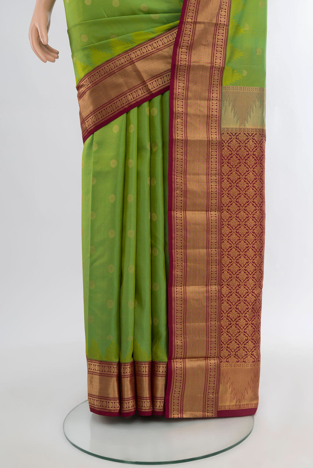 Pleats and pallu of Green Kanchipuram Silk Saree with Zari Butta on the body and Zari Border. 
