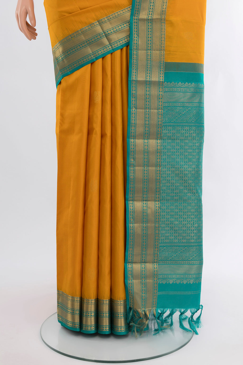Pleats and pallu of Mustard Kanjivaram Silk Saree with Zari Butta on the body and Zari Border. 