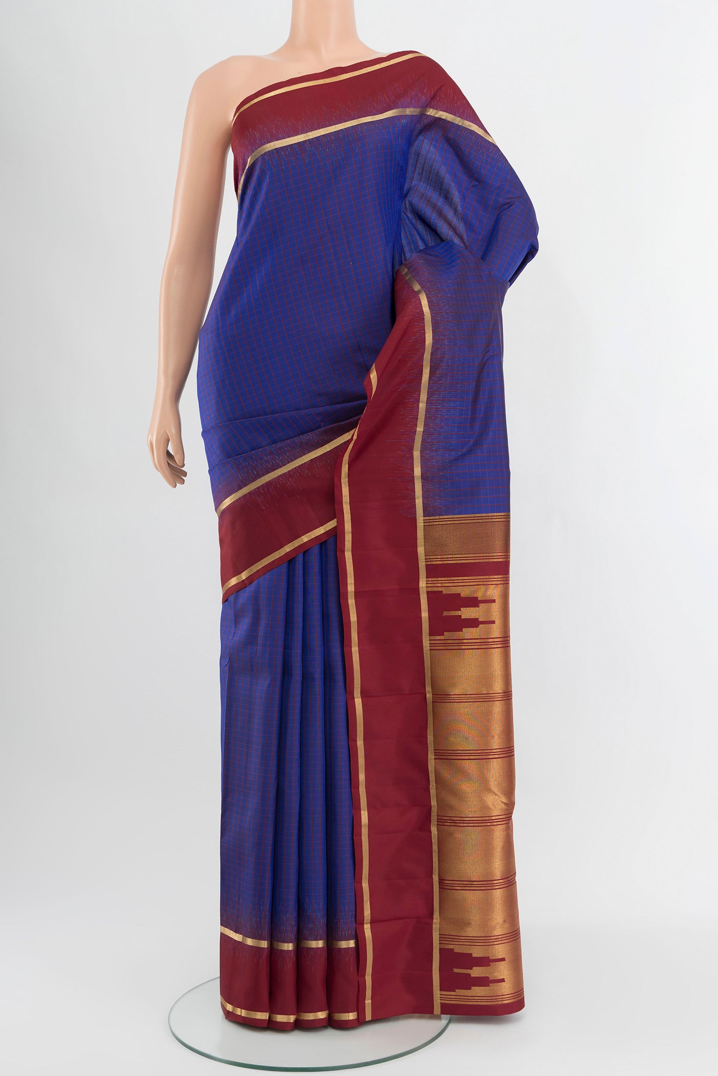 Dark Blue Kanchipuram Silk Saree with Stripes on the body and Plain Border.  displayed on a mannequin