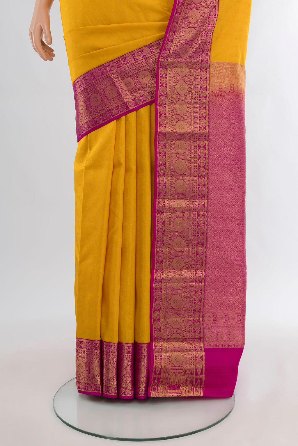 Pleats and pallu of Yellow Kanchipuram Silk Saree with Zari Butta on the body and Zari Border. 