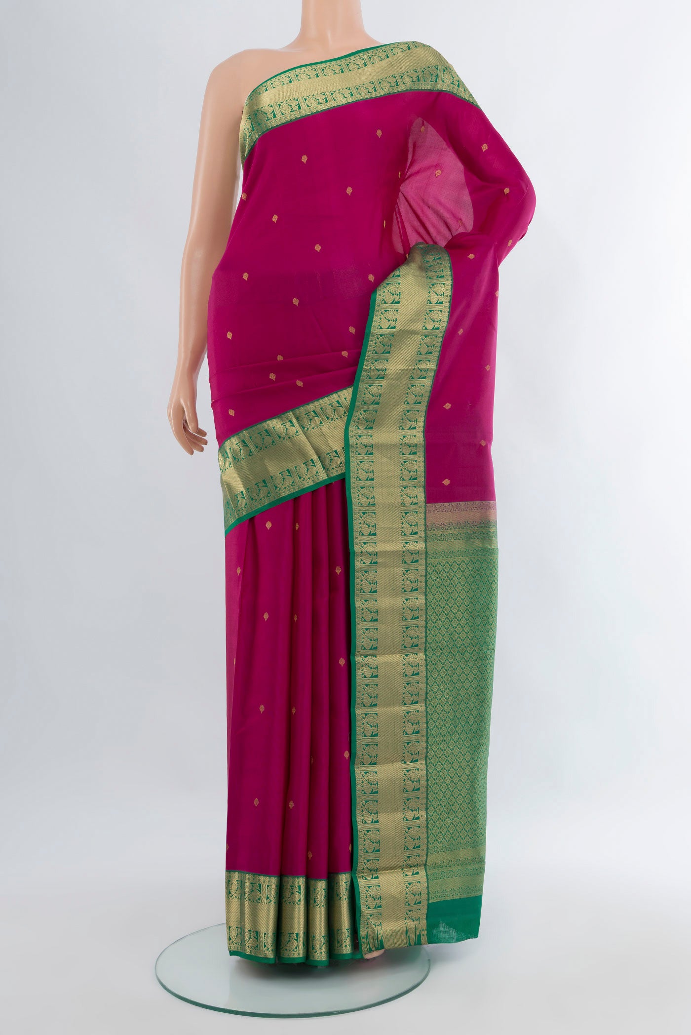Dark Pink Kanchipuram Silk Saree with Zari Butta on the body and Zari Border.  displayed on a mannequin