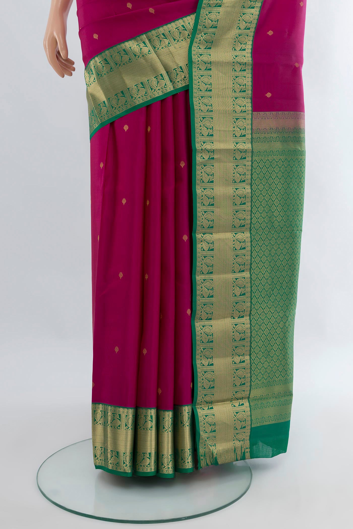 Pleats and pallu of Dark Pink Kanchipuram Silk Saree with Zari Butta on the body and Zari Border. 