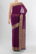 Purple Silk Cotton Saree with Zari Butta on the body and Zari Border.  displayed on a mannequin
