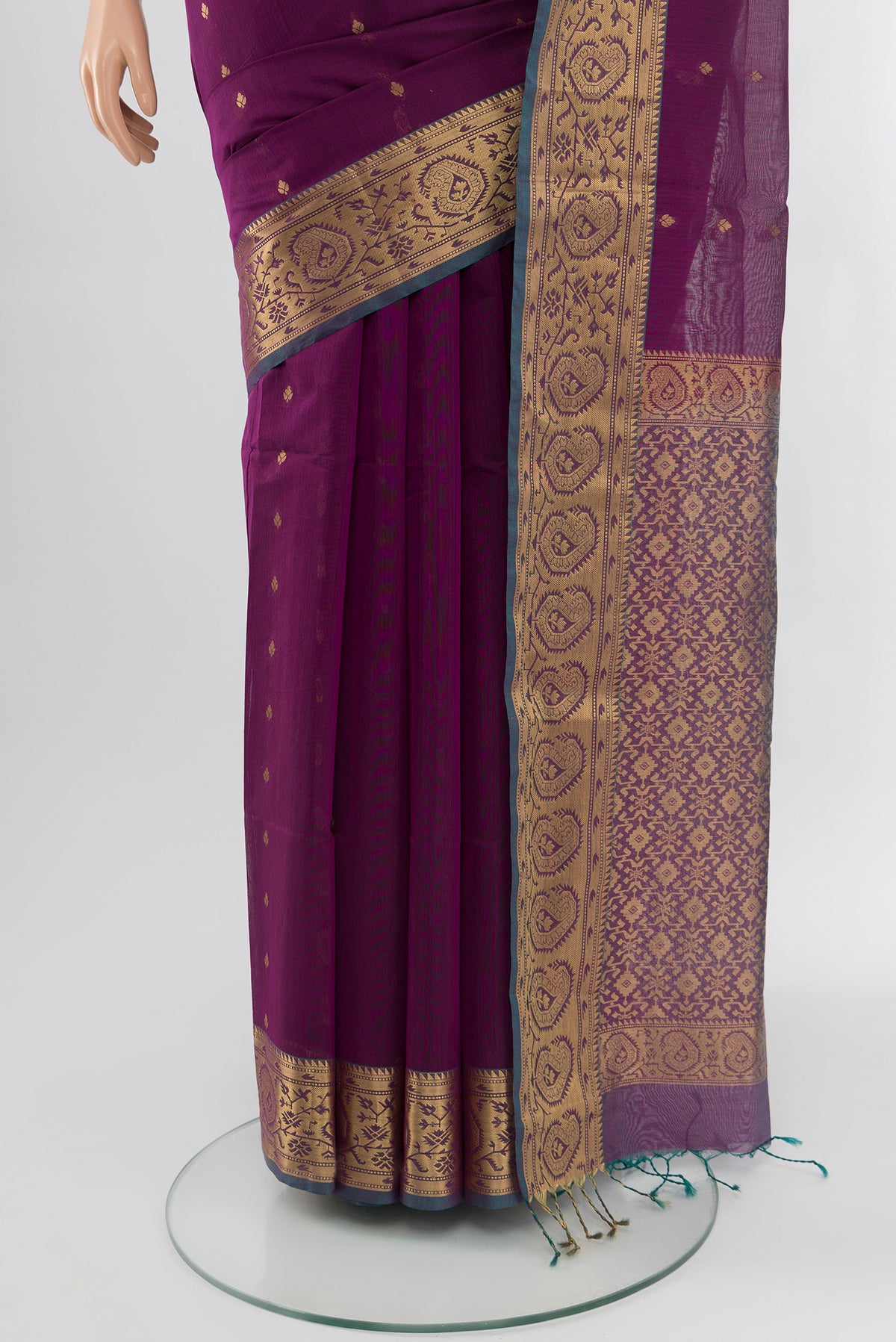 Pleats and pallu of Purple Silk Cotton Saree with Zari Butta on the body and Zari Border. 
