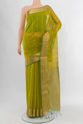 Green Silk Cotton Saree with Zari Butta on the body and Zari Border.  displayed on a mannequin