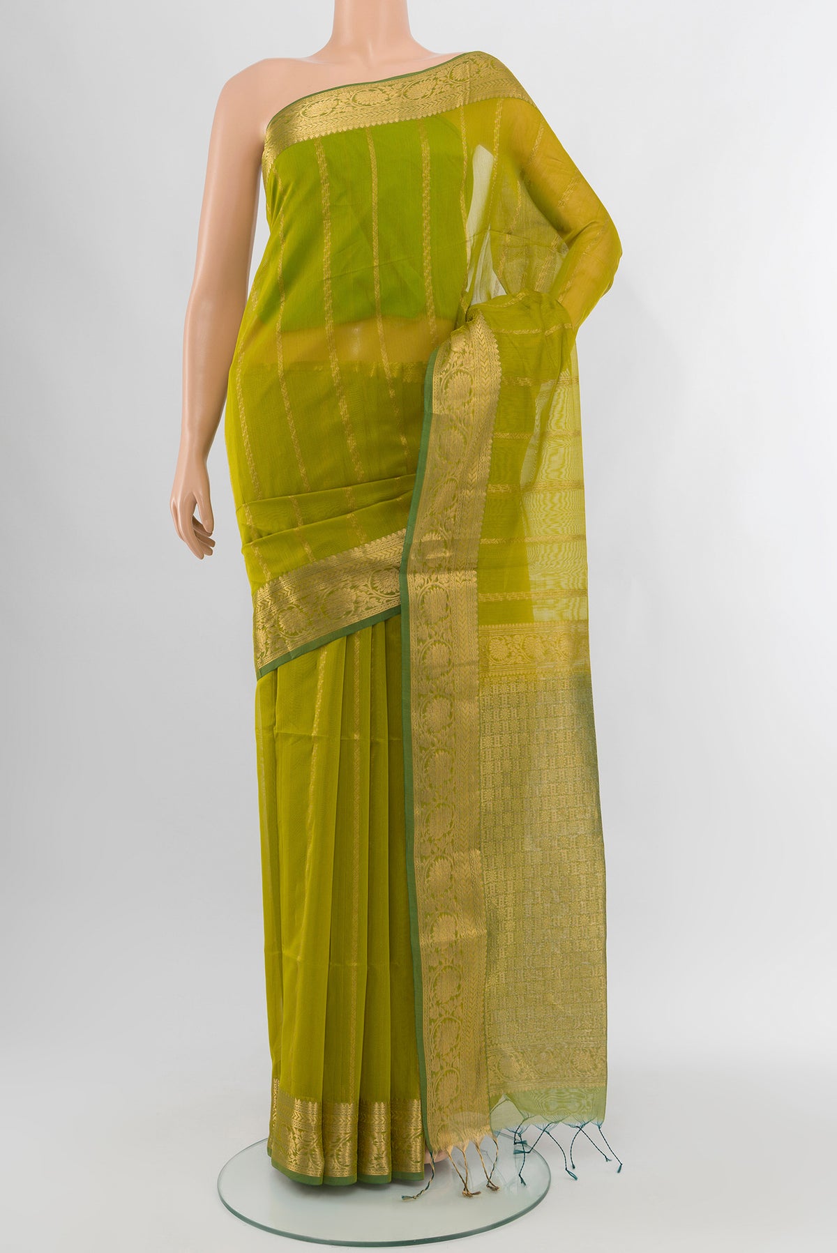 Green Silk Cotton Saree with Zari Butta on the body and Zari Border.  displayed on a mannequin