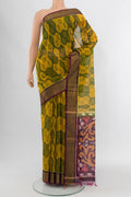 Yellow Silk Cotton Saree with Ikat Print on the body and Zari Border.  displayed on a mannequin