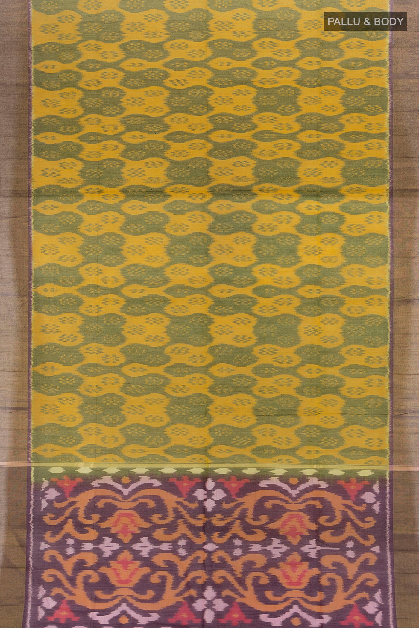 Flat view of Yellow Silk Cotton Saree with Ikat Print on the body and Zari Border. 