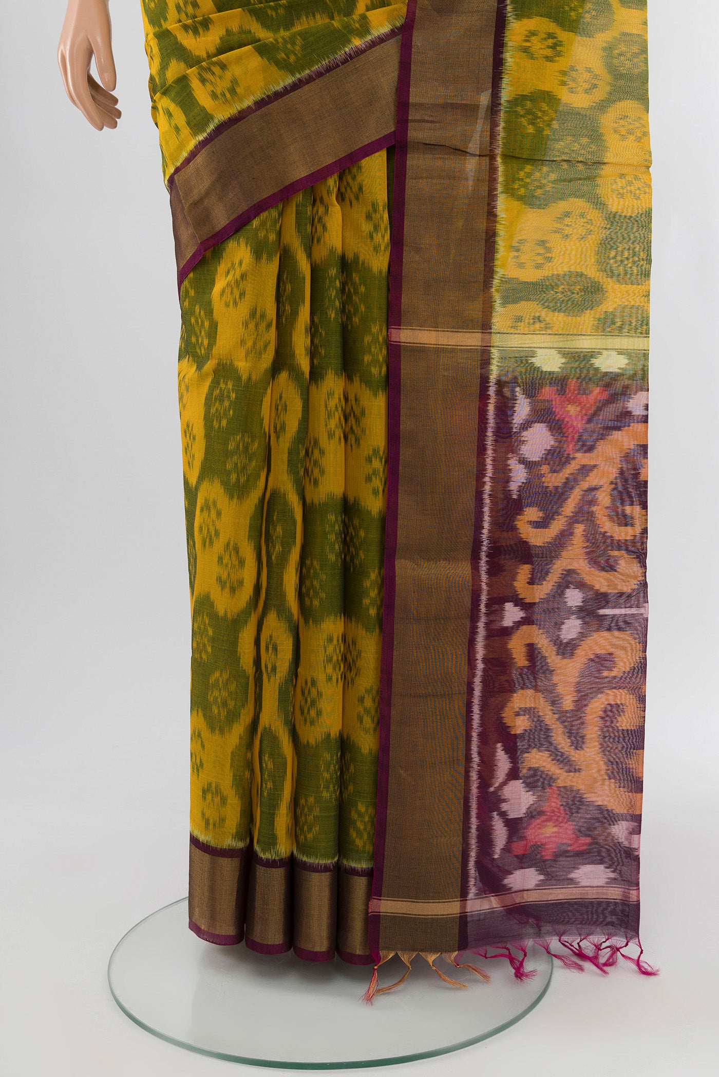 Pleats and pallu of Yellow Silk Cotton Saree with Ikat Print on the body and Zari Border. 