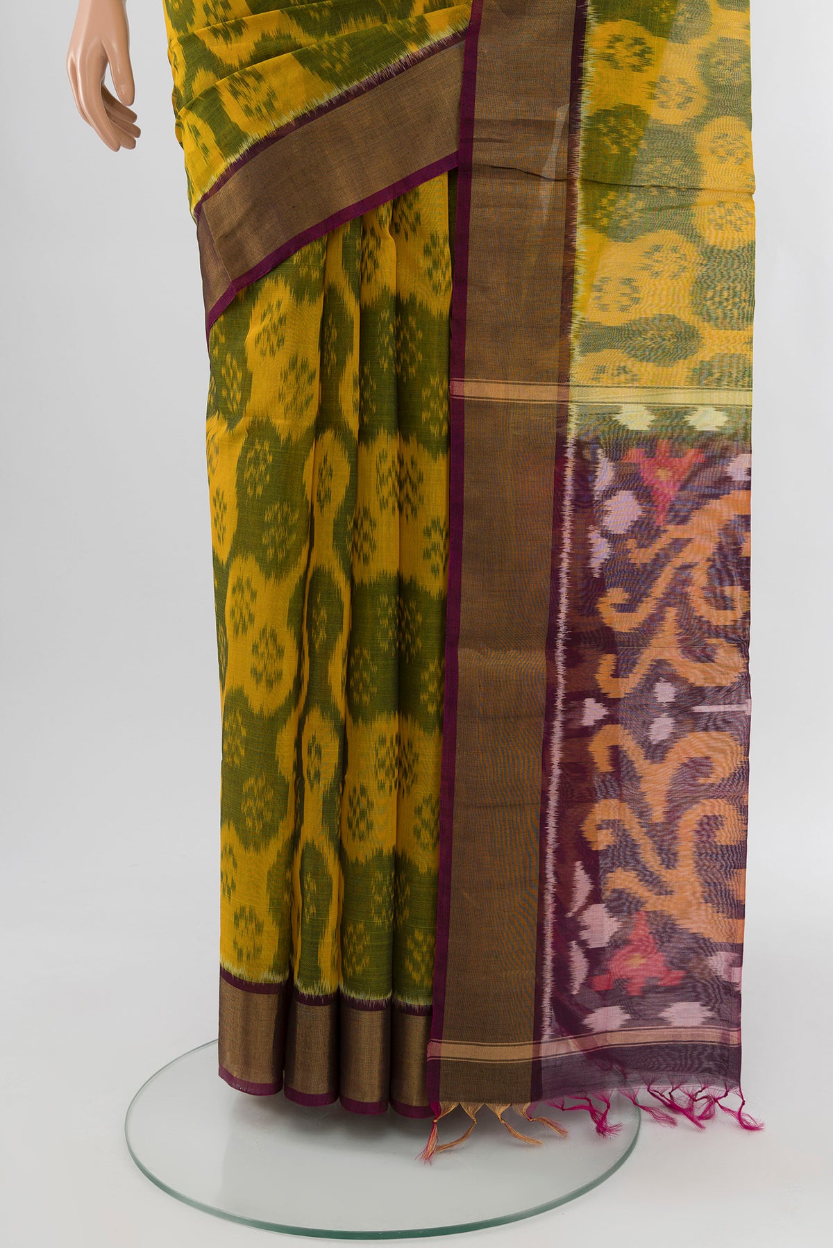 Pleats and pallu of Yellow Silk Cotton Saree with Ikat Print on the body and Zari Border. 