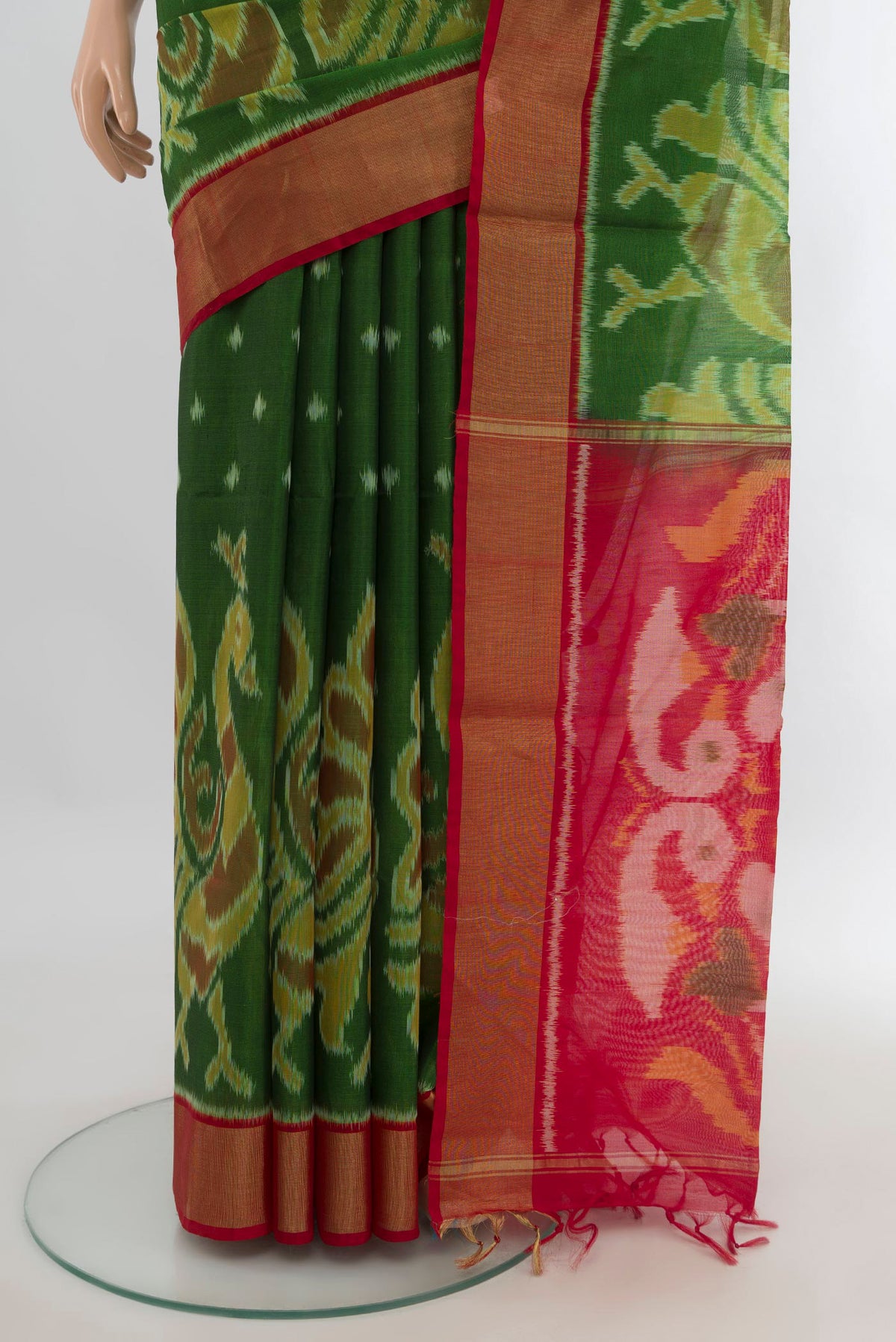 Pleats and pallu of Green Silk Cotton Saree with Ikat Print on the body and Zari Border. 