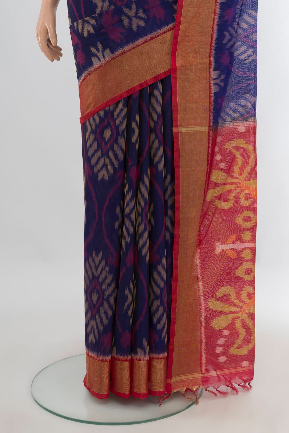 Pleats and pallu of Navy Blue Silk Cotton Saree with Ikat Print on the body and Zari Border. 