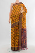 Yellow Silk Cotton Saree with Ikat design on the body and Zari Border.  displayed on a mannequin