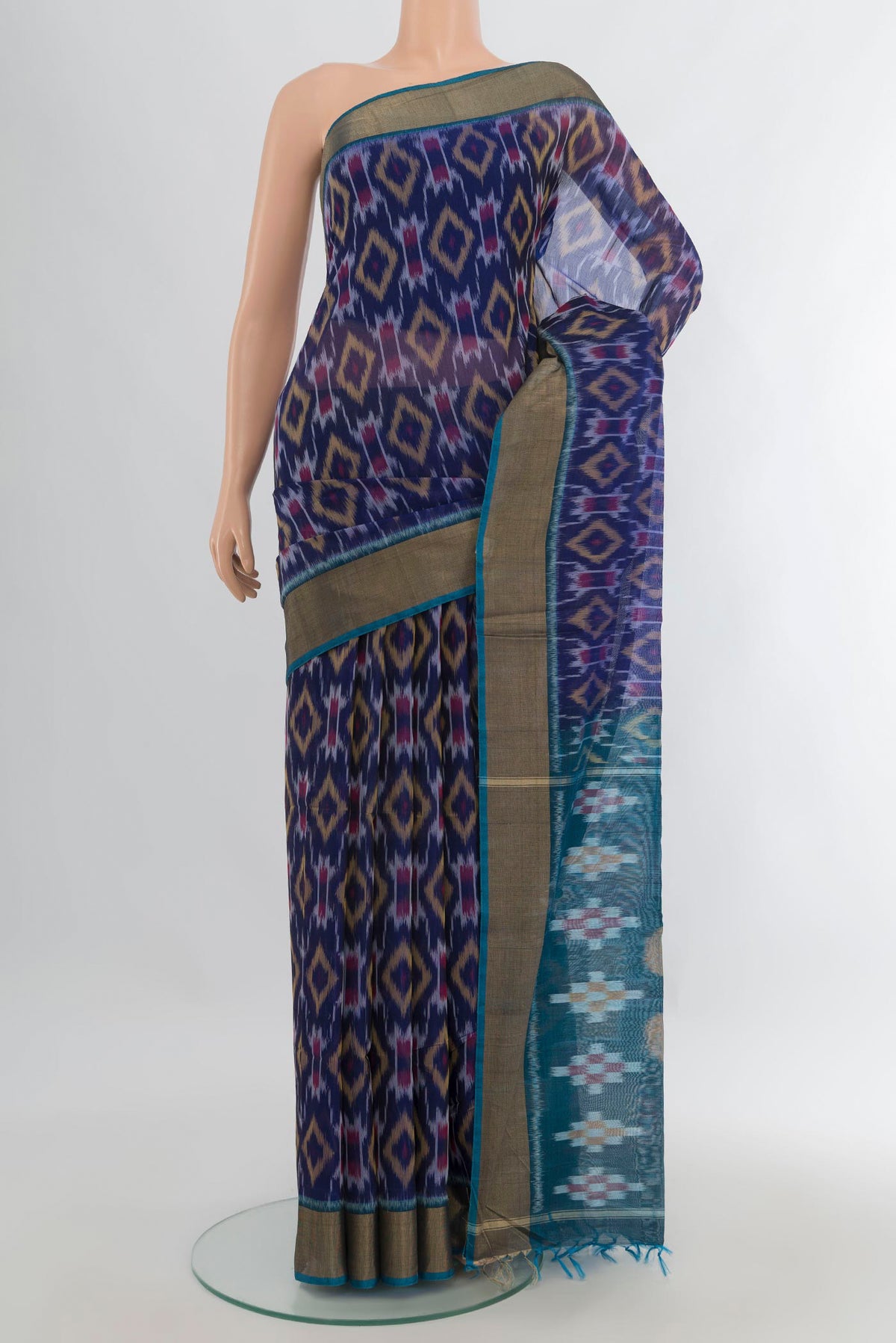 Navy Blue Silk Cotton Saree with Ikat Print on the body and Zari Border.  displayed on a mannequin