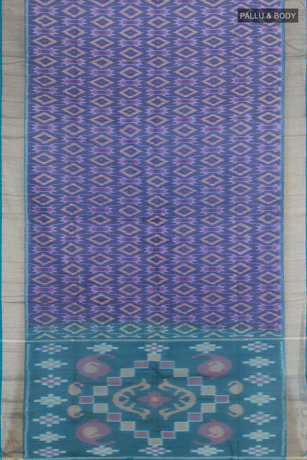 Flat view of Navy Blue Silk Cotton Saree with Ikat Print on the body and Zari Border. 