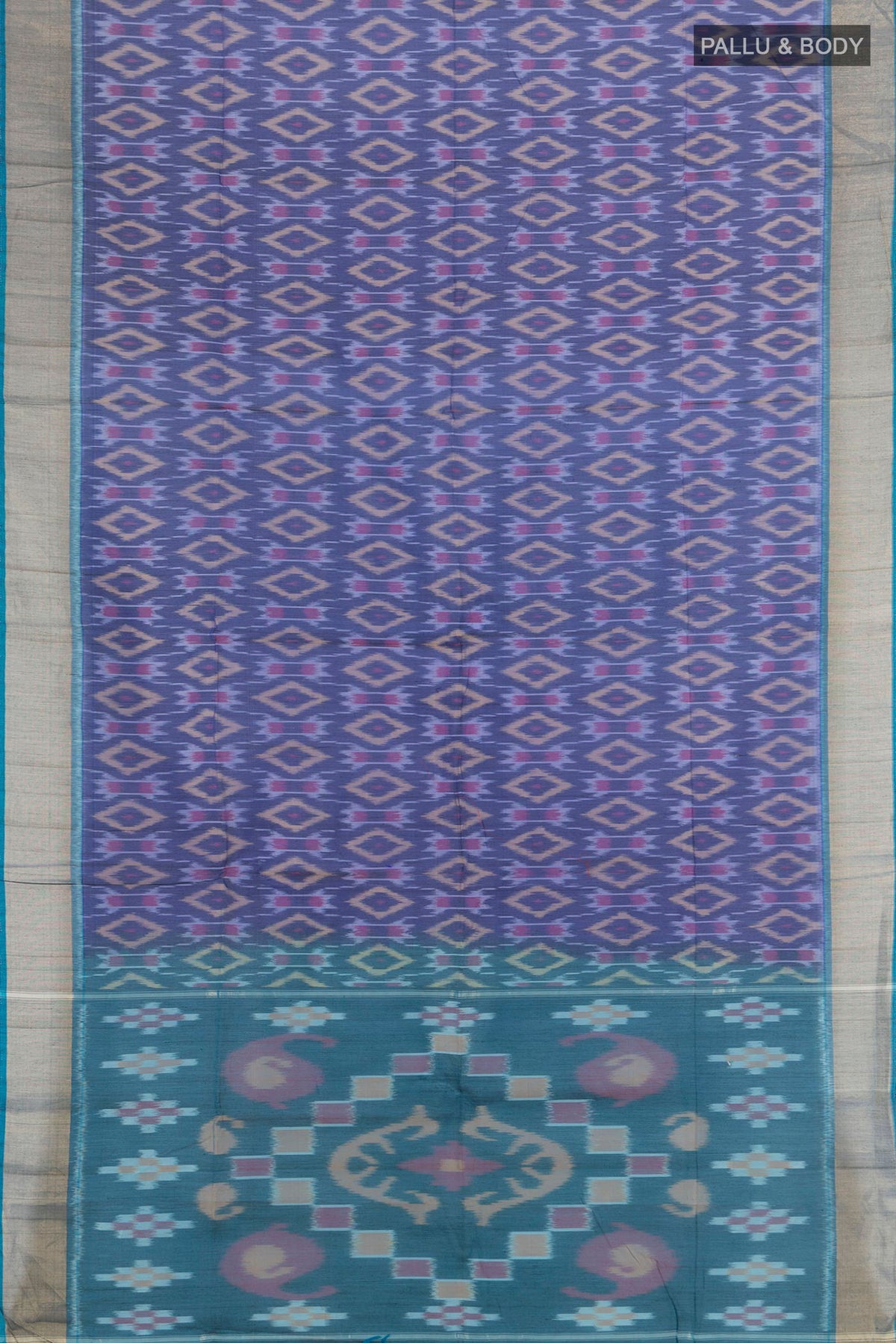 Flat view of Navy Blue Silk Cotton Saree with Ikat Print on the body and Zari Border. 