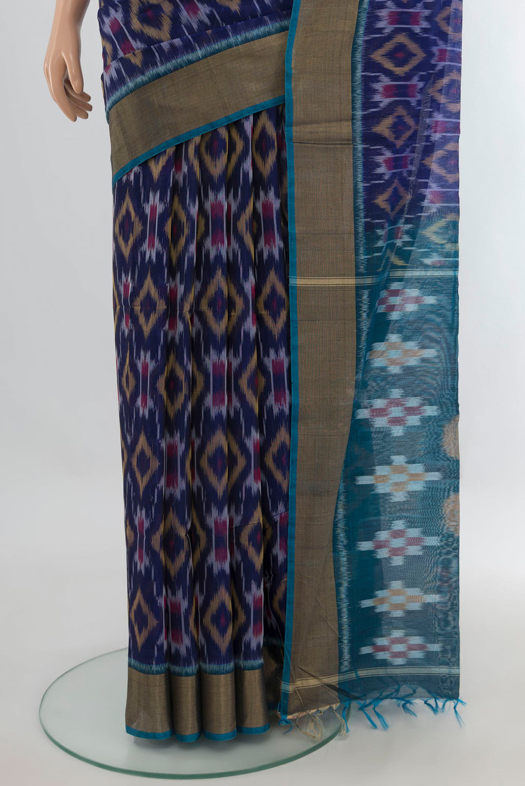 Pleats and pallu of Navy Blue Silk Cotton Saree with Ikat Print on the body and Zari Border. 