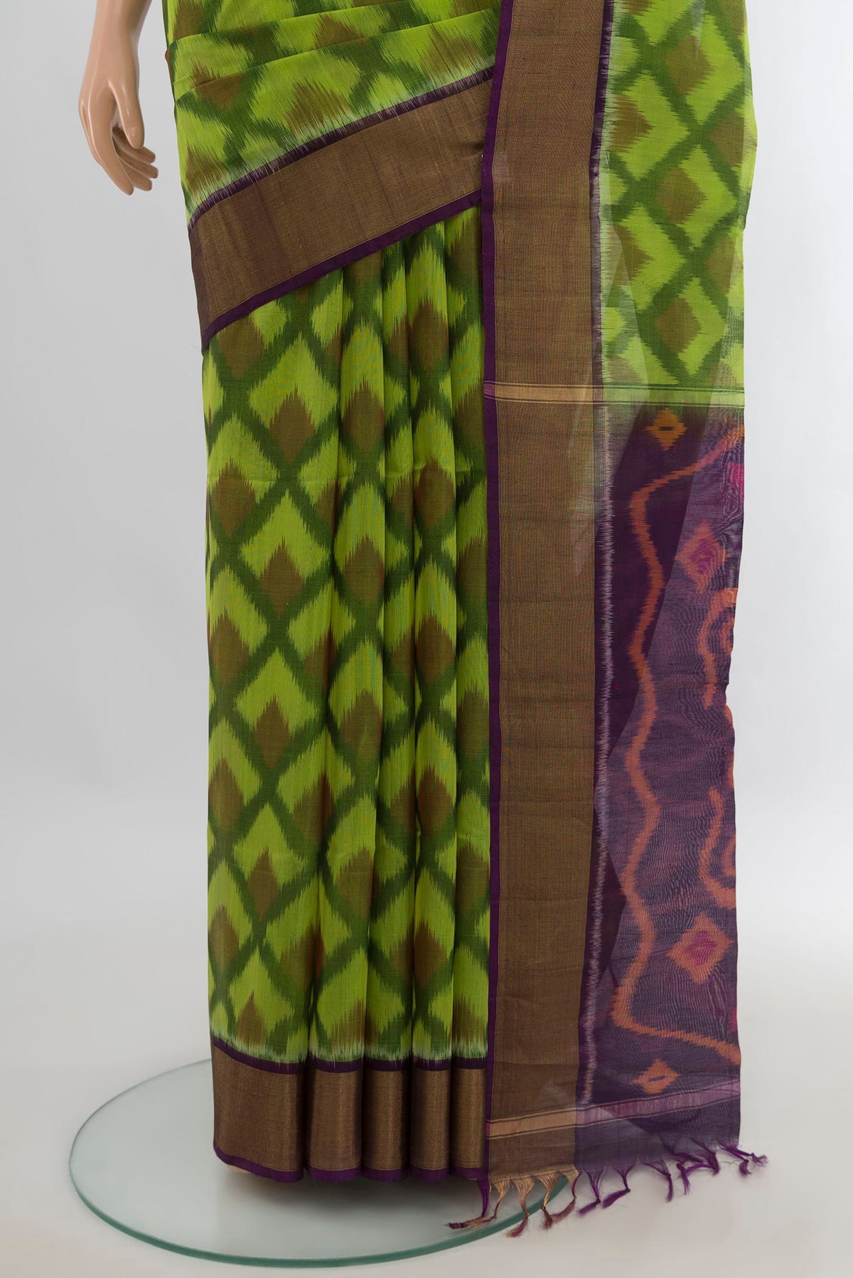 Pleats and pallu of Parrot Green Silk Cotton Saree with Ikat Print on the body and Zari Border. 
