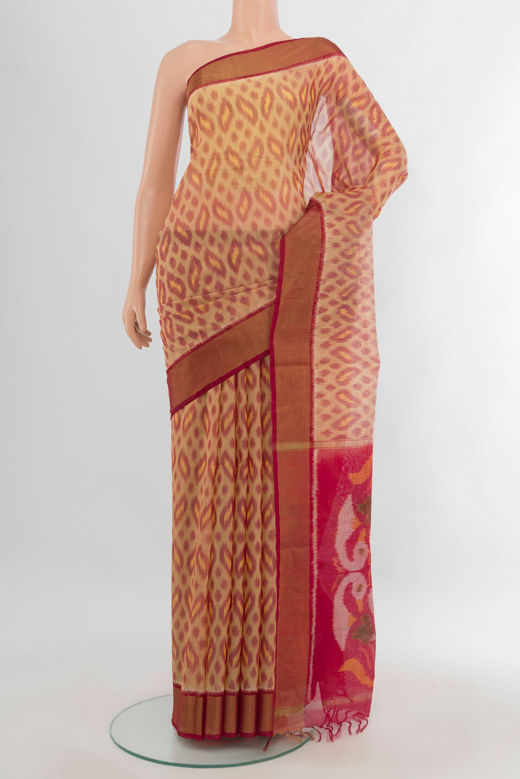 Sandal Silk Cotton Saree with Ikat Print on the body and Zari Border.  displayed on a mannequin