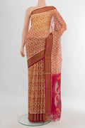 Sandal Silk Cotton Saree with Ikat Print on the body and Zari Border.  displayed on a mannequin