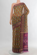 Davys Grey Silk Cotton Saree with Ikat design on the body and Zari Border.  displayed on a mannequin