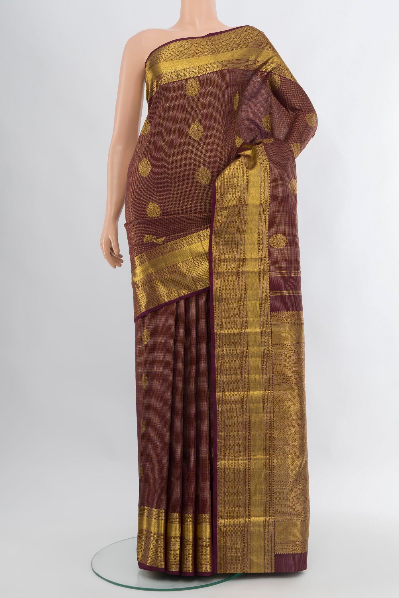 Coffee Brown Kanchipuram Silk Saree with Zari Butta on the body and Zari Border.  displayed on a mannequin