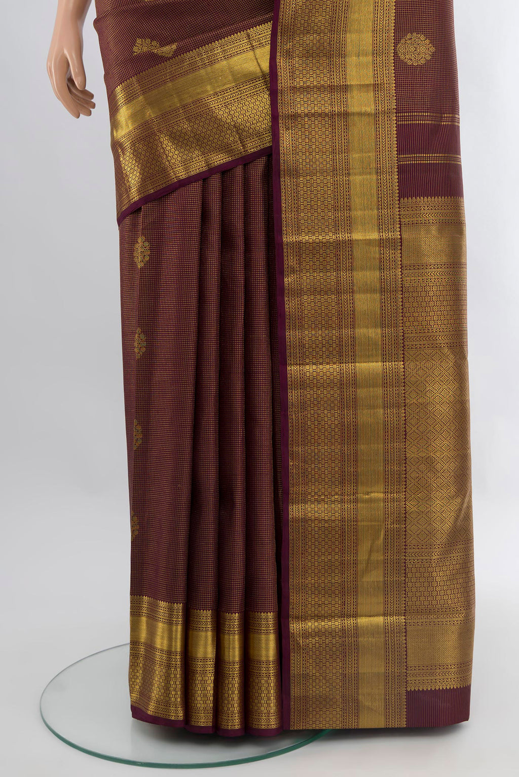 Pleats and pallu of Coffee Brown Kanchipuram Silk Saree with Zari Butta on the body and Zari Border. 