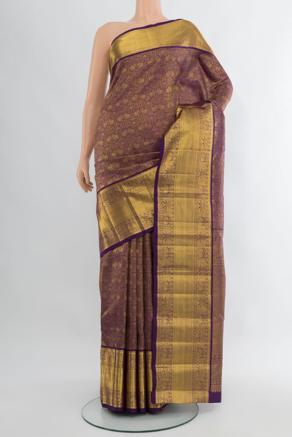 Violet Kanchipuram Silk Saree with Zari Brocade on the body and Zari Border.  displayed on a mannequin