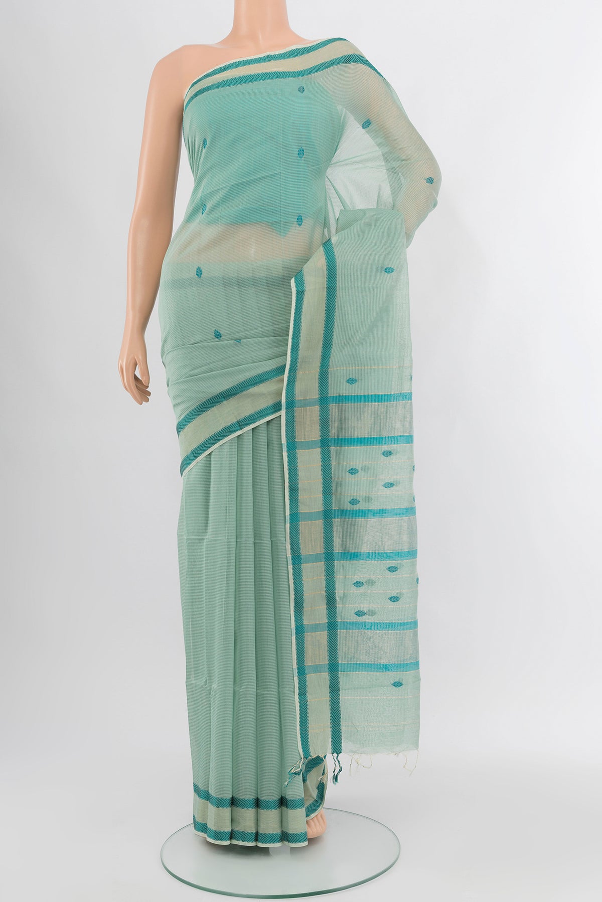 Multi Color Maheshwari Silk Cotton Saree with Zari Butta on the body and Silk Border.  displayed on a mannequin