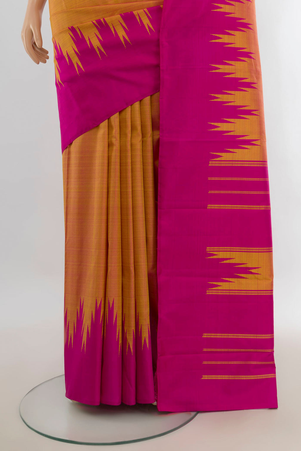 Pleats and pallu of Pure Silk Peach Kanjivaram Saree with Plain Body and Silk Border. 