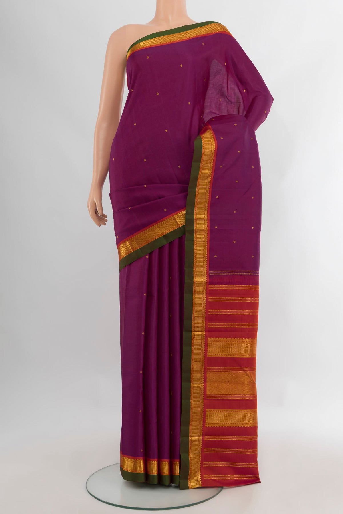Purple Kanchipuram Silk Saree with Zari Butta on the body and Zari Border.  displayed on a mannequin