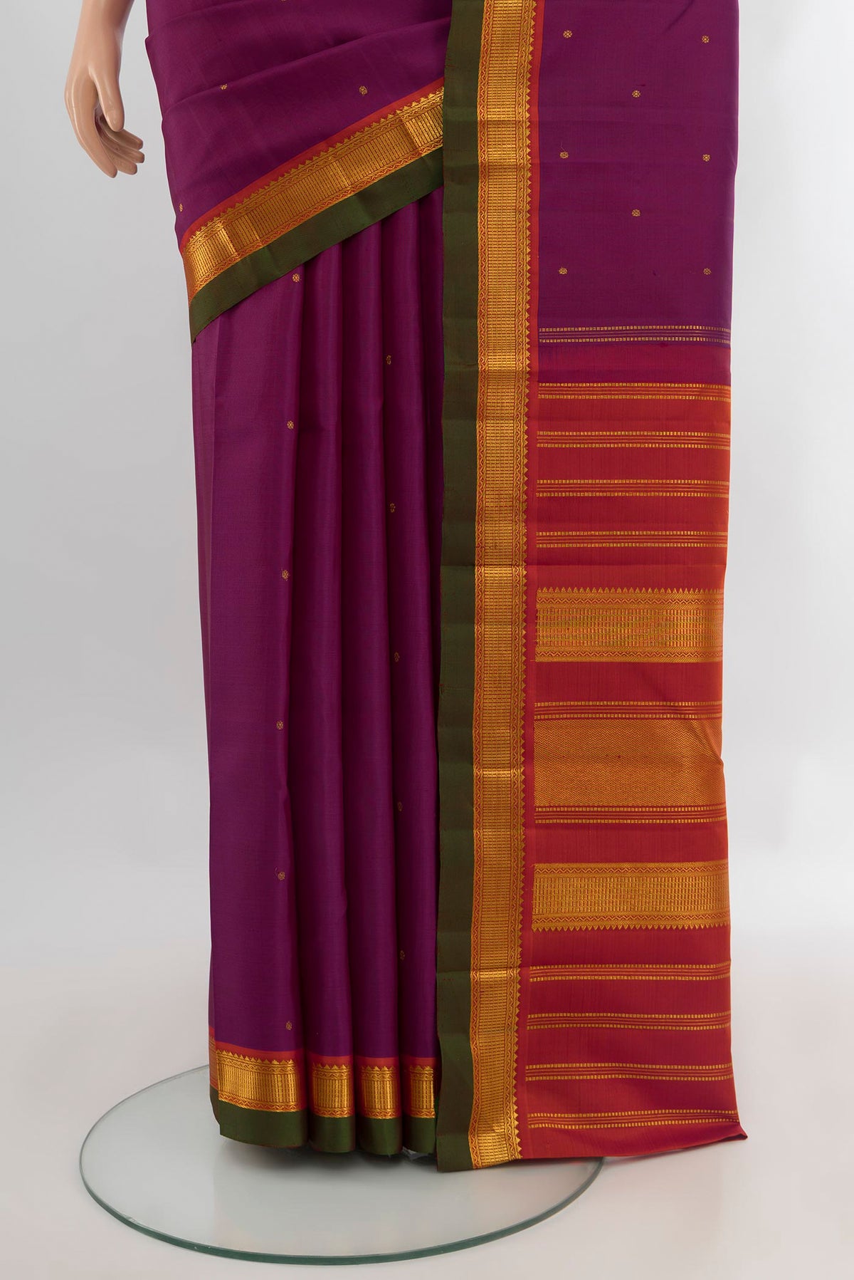 Pleats and pallu of Purple Kanchipuram Silk Saree with Zari Butta on the body and Zari Border. 