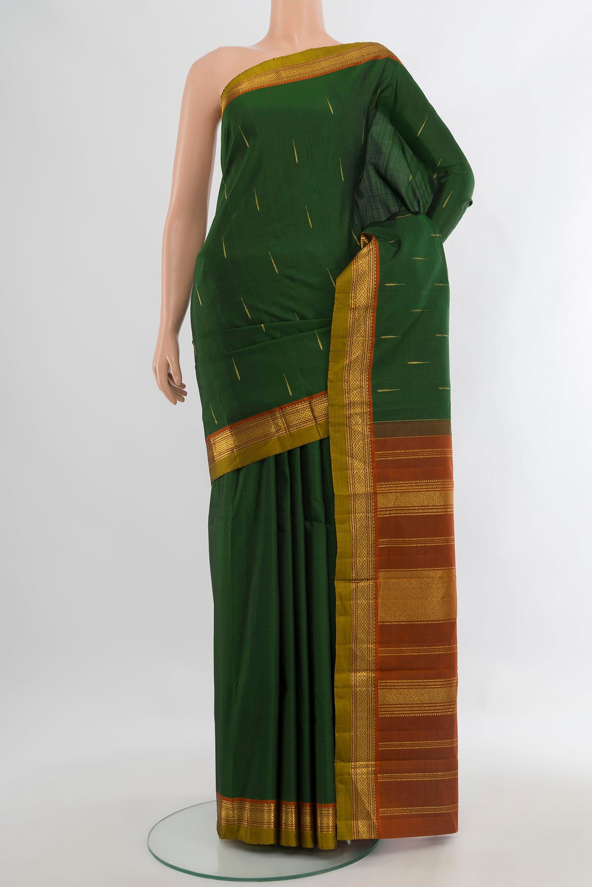 Pure Silk Bottle Green Kanchipuram Saree with Zari Butta on the body and Zari Border.  displayed on a mannequin