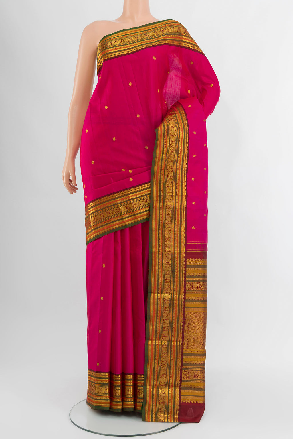 Pink Kanjivaram Silk Saree with Zari Butta on the body and Zari Border.  displayed on a mannequin