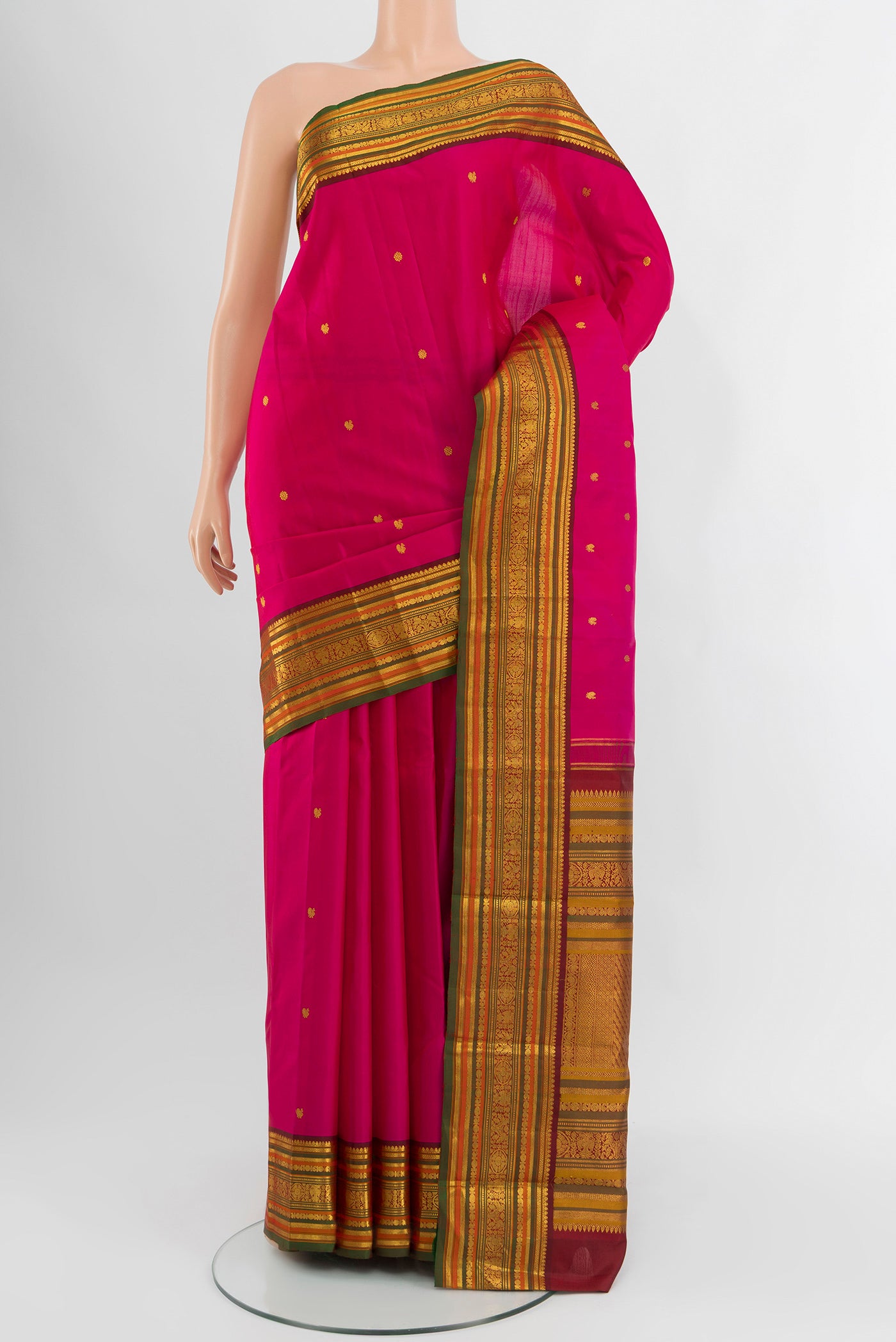 Pink Kanjivaram Silk Saree with Zari Butta on the body and Zari Border.  displayed on a mannequin