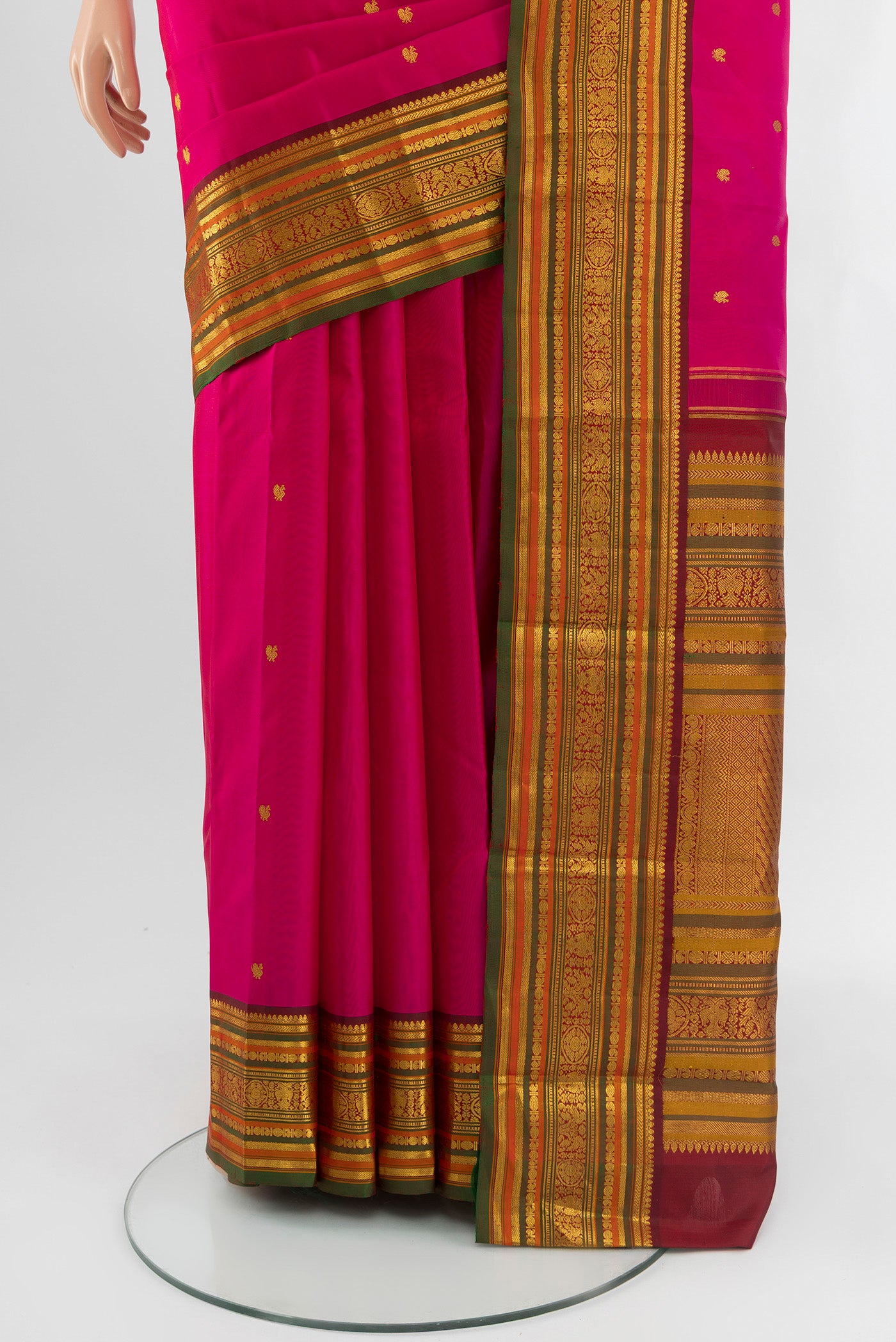 Pleats and pallu of Pink Kanjivaram Silk Saree with Zari Butta on the body and Zari Border. 